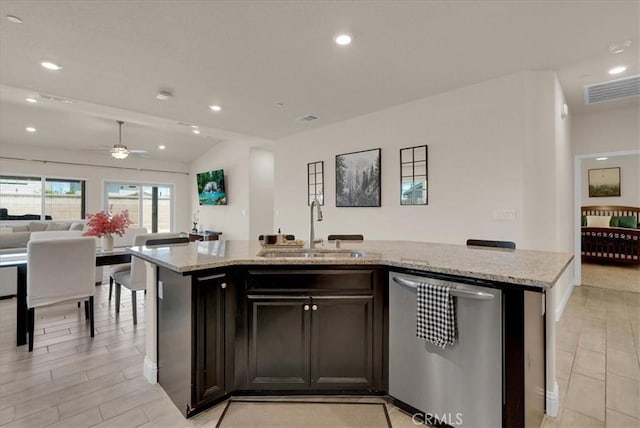 2454 W Mallard Ln, Hanford, CA 93230 - kitchen featuring stainless steel dishwasher, a center island with sink, open floor plan, light stone countertops, and a ceiling fan