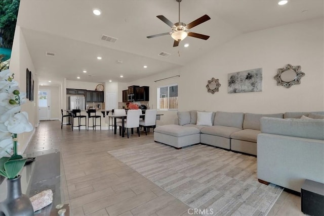2454 W Mallard Ln, Hanford, CA 93230 - living area featuring ceiling fan, vaulted ceiling, healthy amount of natural light, and recessed lighting