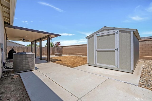 2454 W Mallard Ln, Hanford, CA 93230 - fenced backyard featuring ceiling fan, a patio area, and a shed