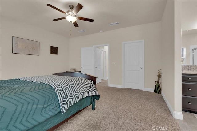 2454 W Mallard Ln, Hanford, CA 93230 - bedroom with light colored carpet and a ceiling fan