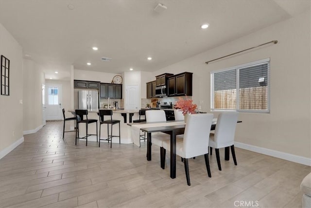 2454 W Mallard Ln, Hanford, CA 93230 - dining space featuring light wood-style floors and recessed lighting