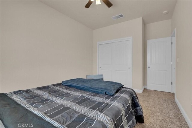 2454 W Mallard Ln, Hanford, CA 93230 - carpeted bedroom with a closet and a ceiling fan