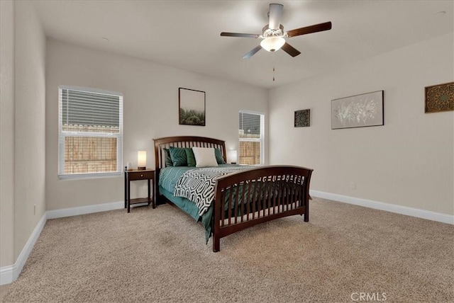 2454 W Mallard Ln, Hanford, CA 93230 - carpeted bedroom featuring multiple windows and a ceiling fan