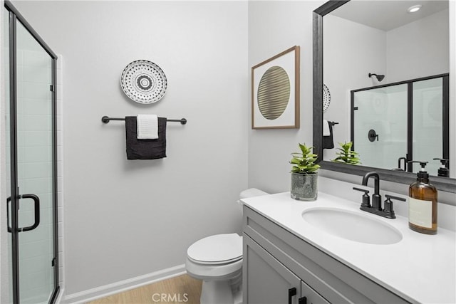 16357 Sandpiper Ave, Chino, CA 91708 - bathroom with vanity, a stall shower, and wood finished floors