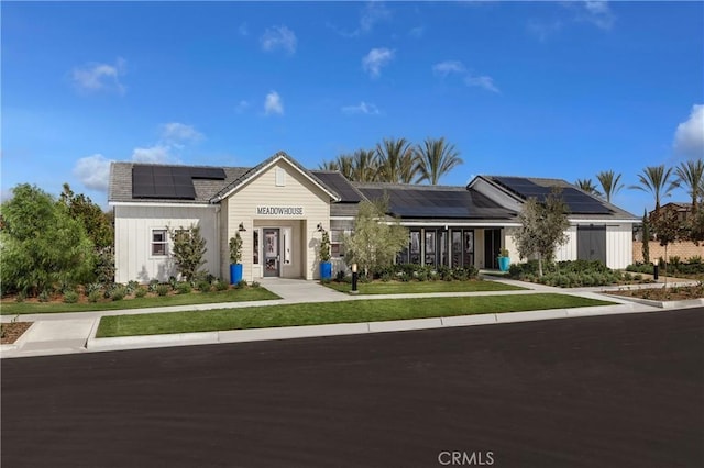 16357 Sandpiper Ave, Chino, CA 91708 - view of front of house featuring solar panels and a front lawn