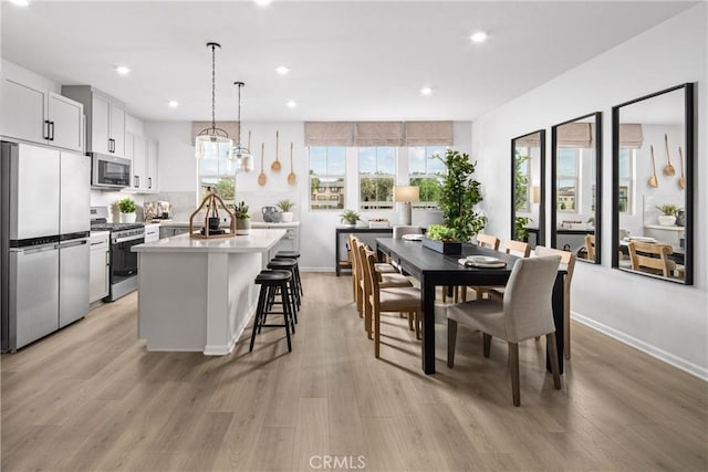 16357 Sandpiper Ave, Chino, CA 91708 - dining area with light wood finished floors and recessed lighting