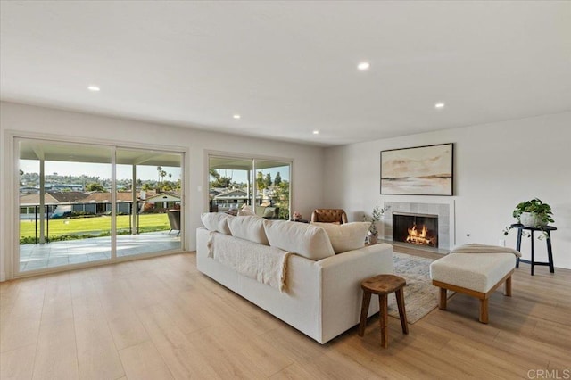 1515 San Pablo Dr, San Marcos, CA 92078 - living room featuring light wood-type flooring, recessed lighting, and a tile fireplace