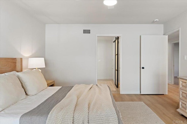 1515 San Pablo Dr, San Marcos, CA 92078 - bedroom with light wood-type flooring and a spacious closet