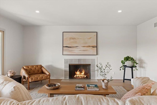 1515 San Pablo Dr, San Marcos, CA 92078 - living room featuring a tiled fireplace, wood finished floors, and recessed lighting