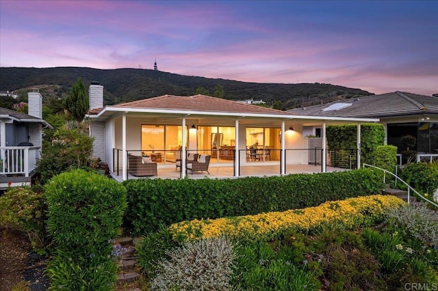 1515 San Pablo Dr, San Marcos, CA 92078 - rear view of property featuring a mountain view, a patio, and a chimney