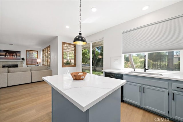 33307 Decada St, Temecula, CA 92592 - kitchen featuring gray cabinetry, light wood finished floors, healthy amount of natural light, hanging light fixtures, and recessed lighting