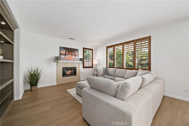 33307 Decada St, Temecula, CA 92592 - living area with wood finished floors and a fireplace