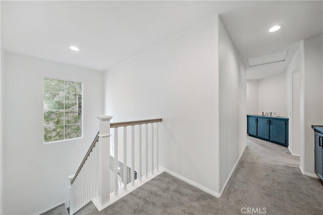 33307 Decada St, Temecula, CA 92592 - hallway with an upstairs landing, carpet floors, attic access, and recessed lighting