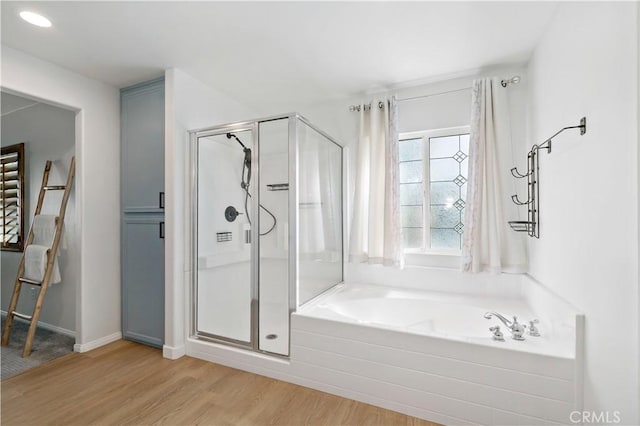 33307 Decada St, Temecula, CA 92592 - bathroom with wood finished floors, a stall shower, and a garden tub