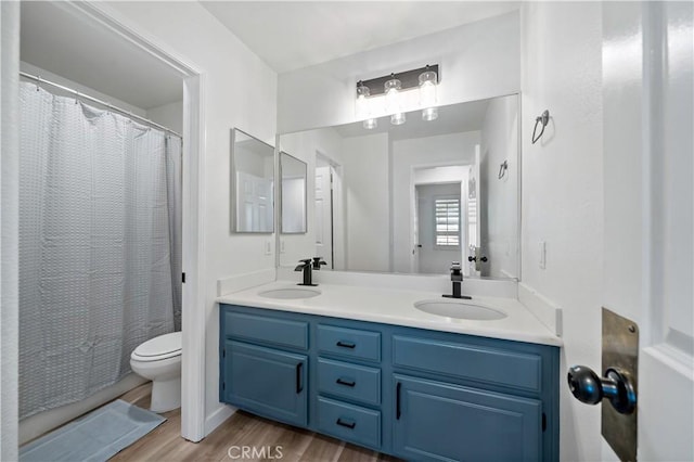 33307 Decada St, Temecula, CA 92592 - bathroom with double vanity, wood finished floors, and curtained shower