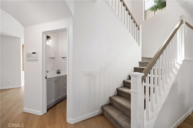 33307 Decada St, Temecula, CA 92592 - staircase with wood finished floors and arched walkways