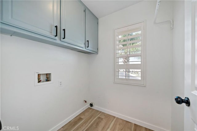 33307 Decada St, Temecula, CA 92592 - laundry room with cabinet space, light wood finished floors, washer hookup, and hookup for a gas dryer