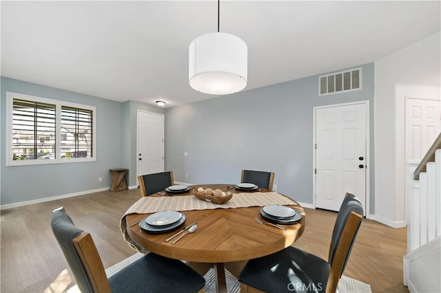 33307 Decada St, Temecula, CA 92592 - dining area featuring wood finished floors and stairs