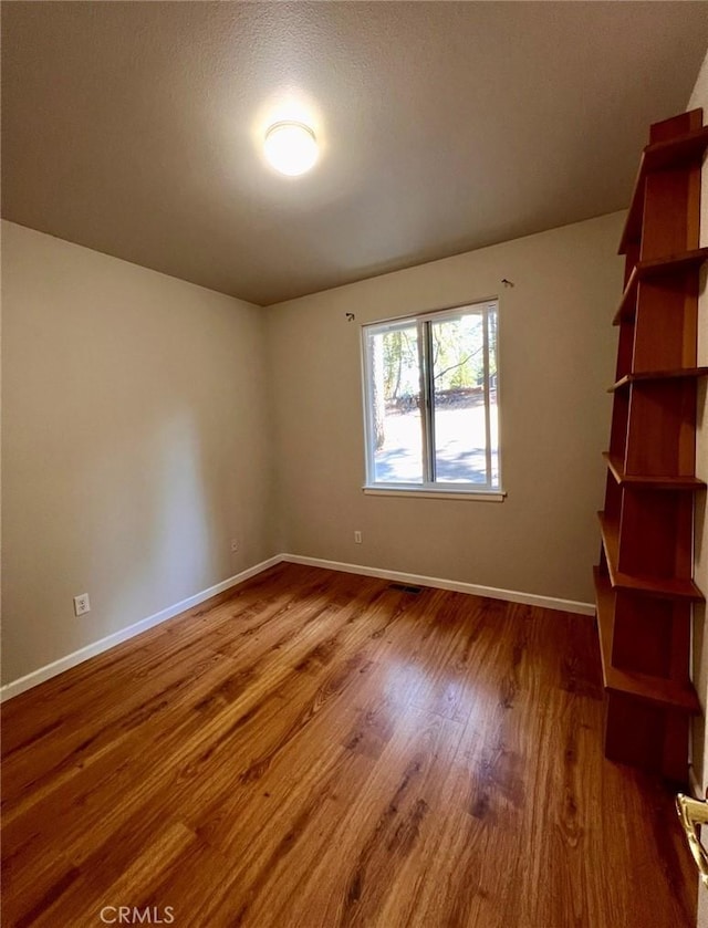 1290 Tuck Rd, Willits, CA 95490 - unfurnished room with wood finished floors and baseboards