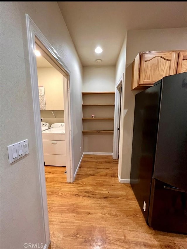 1290 Tuck Rd, Willits, CA 95490 - corridor featuring light wood finished floors and washing machine and clothes dryer