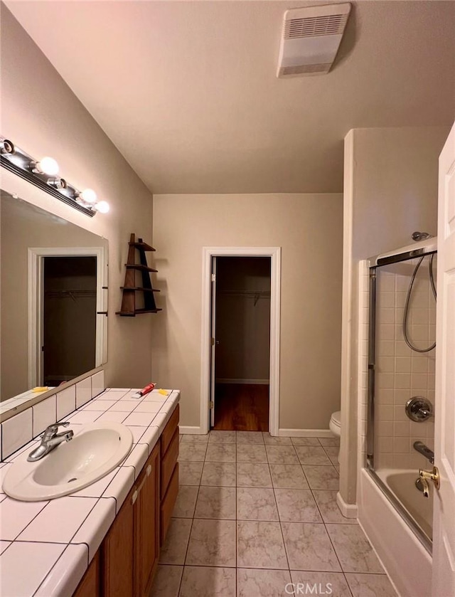 1290 Tuck Rd, Willits, CA 95490 - bathroom with vanity, a walk in closet, shower / bathtub combination, and marble finish floors