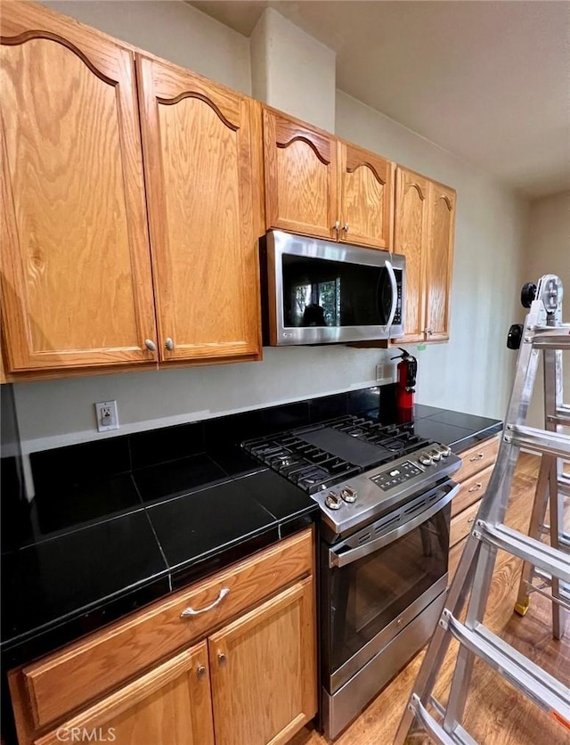 1290 Tuck Rd, Willits, CA 95490 - kitchen with appliances with stainless steel finishes and tile counters