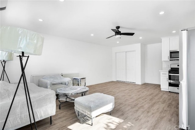 4851 Faculty Ave, Long Beach, CA 90808 - living room featuring ceiling fan, light wood-style floors, and recessed lighting