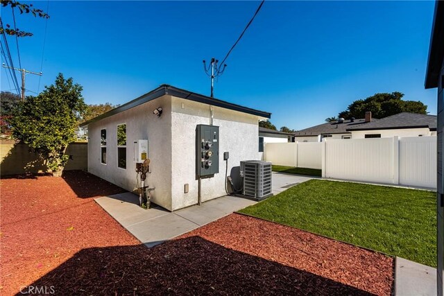 4851 Faculty Ave, Long Beach, CA 90808 - rear view of property with stucco siding, a fenced backyard, and a patio area