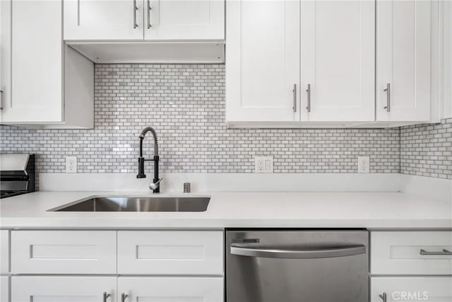 4851 Faculty Ave, Long Beach, CA 90808 - kitchen featuring dishwasher, light countertops, white cabinetry, and tasteful backsplash