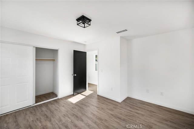 4851 Faculty Ave, Long Beach, CA 90808 - unfurnished bedroom featuring wood finished floors and a closet