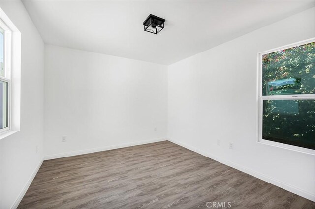 4851 Faculty Ave, Long Beach, CA 90808 - empty room with wood finished floors and plenty of natural light