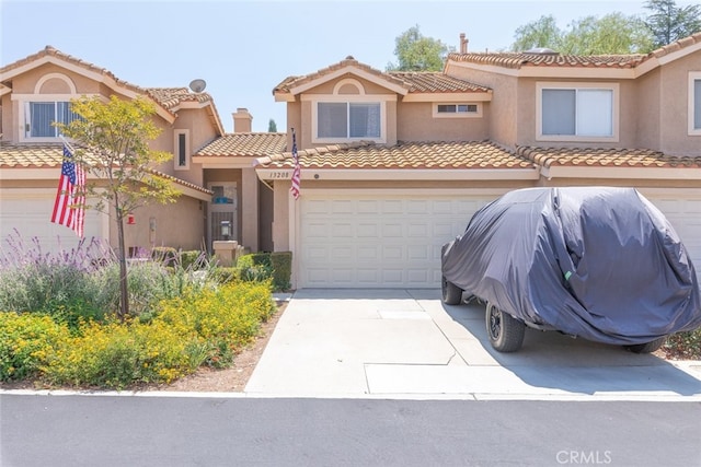 13208 Setting Sun Ct, Chino Hills, CA 91709 - view of front of property with a tiled roof, stucco siding, concrete driveway, and an attached garage