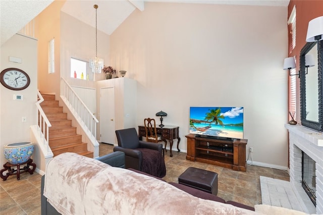 13208 Setting Sun Ct, Chino Hills, CA 91709 - living room with high vaulted ceiling, healthy amount of natural light, stairway, a fireplace, and stone finish flooring
