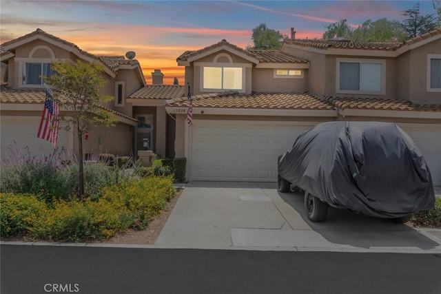 13208 Setting Sun Ct, Chino Hills, CA 91709 - view of front of house featuring a tiled roof, driveway, and stucco siding