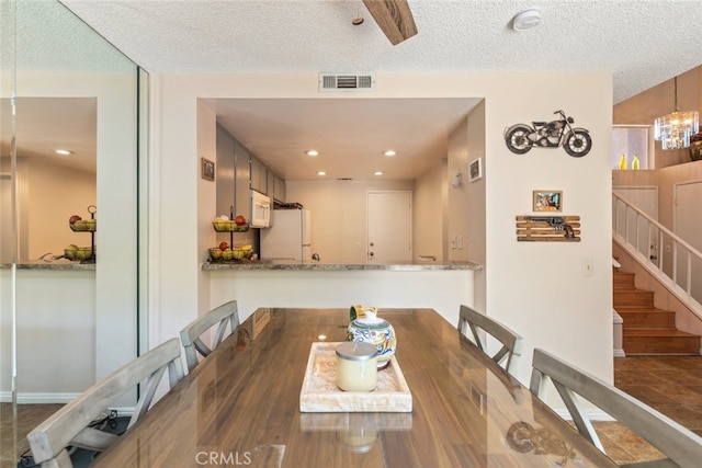 13208 Setting Sun Ct, Chino Hills, CA 91709 - dining room with a textured ceiling, stairway, and a chandelier