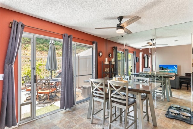 13208 Setting Sun Ct, Chino Hills, CA 91709 - dining space with a ceiling fan, plenty of natural light, stone finish floors, and a textured ceiling