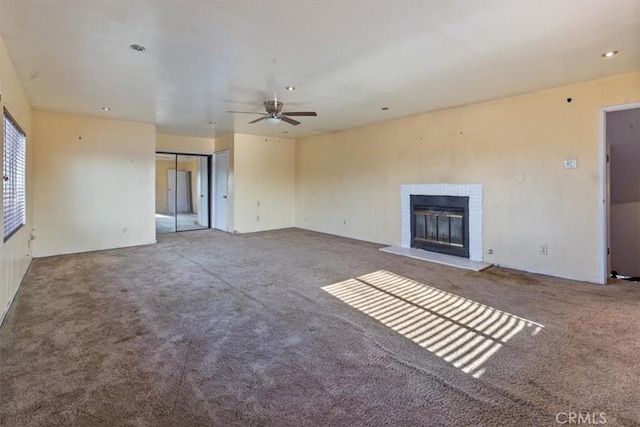 347 E 97th St, Los Angeles, CA 90003 - unfurnished living room with carpet floors, a fireplace, and a ceiling fan