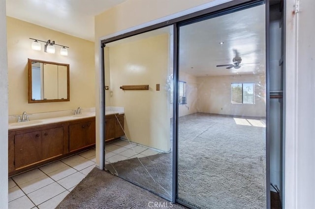 347 E 97th St, Los Angeles, CA 90003 - full bathroom with double vanity, tile patterned flooring, and ceiling fan