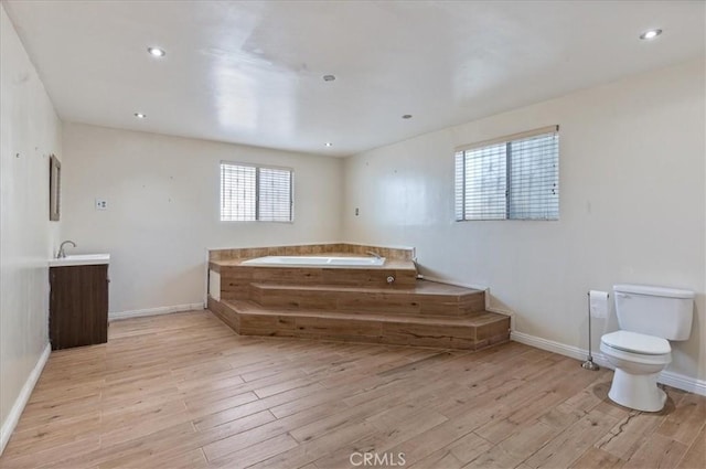 347 E 97th St, Los Angeles, CA 90003 - full bath featuring a garden tub, wood finished floors, vanity, and recessed lighting