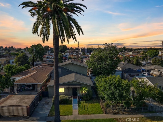 347 E 97th St, Los Angeles, CA 90003 - view of front of house with a fenced front yard, a residential view, and concrete driveway
