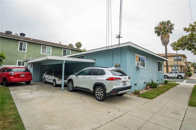 290 W 19th St, Long Beach, CA 90806 - view of front of house featuring a carport, stucco siding, and cooling unit