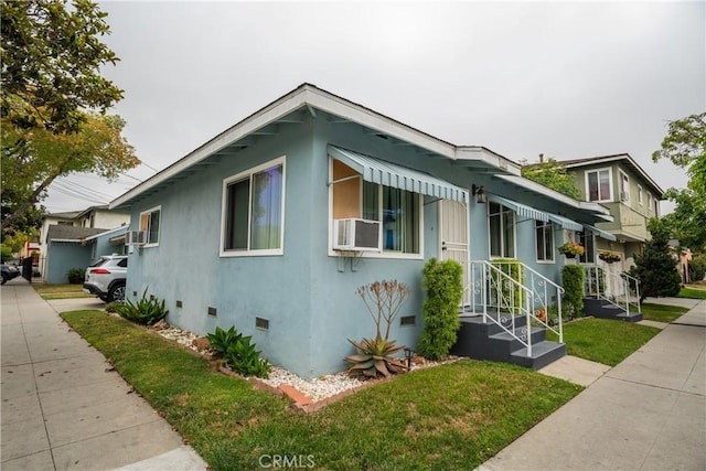 290 W 19th St, Long Beach, CA 90806 - view of side of home with crawl space, stucco siding, a lawn, and cooling unit
