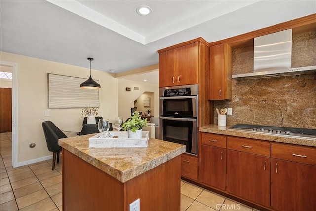 24002 Plover Ln, Laguna Niguel, CA 92677 - kitchen featuring appliances with stainless steel finishes, light tile patterned floors, wall chimney exhaust hood, a kitchen island, and tasteful backsplash
