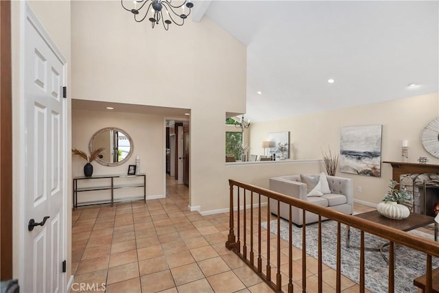 24002 Plover Ln, Laguna Niguel, CA 92677 - hallway featuring a chandelier, recessed lighting, high vaulted ceiling, and light tile patterned floors