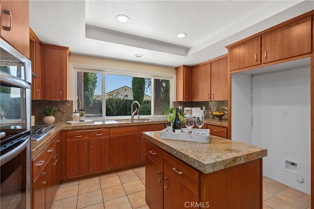 24002 Plover Ln, Laguna Niguel, CA 92677 - kitchen with brown cabinetry, a center island, decorative backsplash, recessed lighting, and light tile patterned flooring