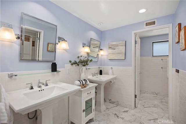 24002 Plover Ln, Laguna Niguel, CA 92677 - bathroom with tile walls, marble finish flooring, and a wainscoted wall