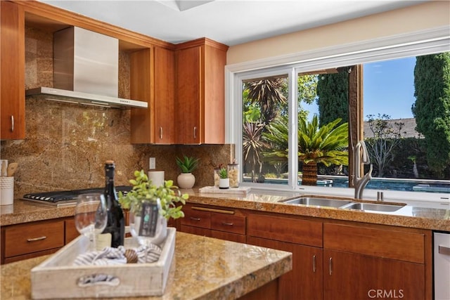 24002 Plover Ln, Laguna Niguel, CA 92677 - kitchen with wall chimney range hood, brown cabinetry, and decorative backsplash