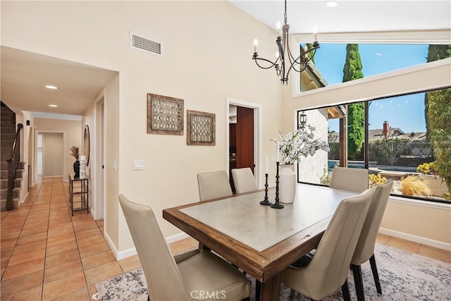 24002 Plover Ln, Laguna Niguel, CA 92677 - dining space with a chandelier, light tile patterned floors, a towering ceiling, and recessed lighting