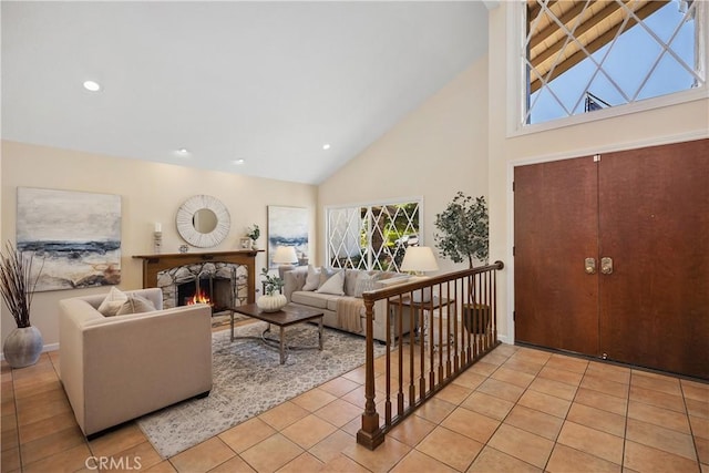 24002 Plover Ln, Laguna Niguel, CA 92677 - living area featuring high vaulted ceiling, light tile patterned floors, a stone fireplace, and recessed lighting