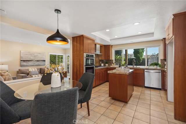 24002 Plover Ln, Laguna Niguel, CA 92677 - kitchen with stainless steel appliances, open floor plan, healthy amount of natural light, a tray ceiling, and recessed lighting
